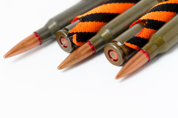 orange-black ribbon of St. George and cartridges, as a symbol, isolated on white background.