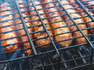 Natural sausages fried on the grill. BBQ