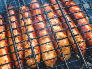 Natural sausages fried on the grill. BBQ