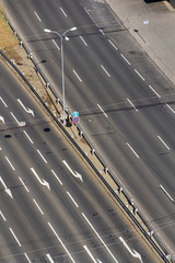Obraz premium White arrows on driving lanes on empty road, autonomous technology