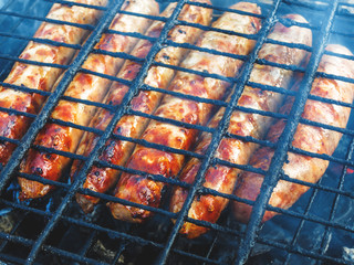 Natural sausages fried on the grill. BBQ