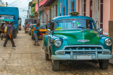 Green vintage car in Trinidad, Cuba 