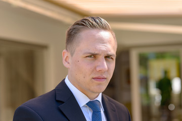 Fototapeta premium Sceptical disbelieving young businessman
