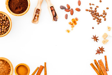 Seasoning for cooking desserts. Cinnamon, cocoa, badian, coffee, sugar on white background top view copy space