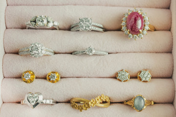 Gold and silver diamond gemstone ring and earrings in luxury jewelry box