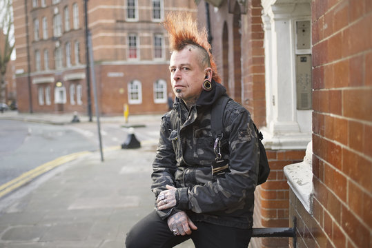 Portrait of a male punk with mohican hair
