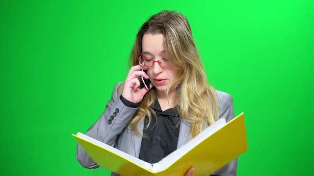 Office manager with a report folder. It does not agree with the data. Insists on his opinion. Green screen background.