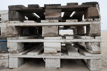 pile of pallets on the beach