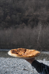 Caucasian khychin bread pie with meat close