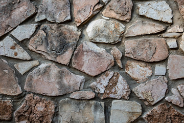 Close up of natural stone wall. Stone wall texture 