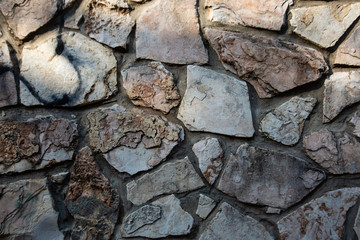 Close up of natural stone wall. Stone wall texture 
