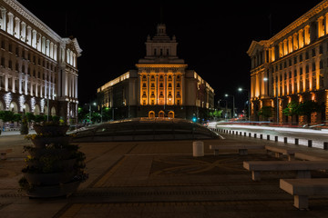 Fototapeta na wymiar The City centre of Sofia at night, Bulgaria. Buildings of Presidency, Council of Ministers and Former Communist Party House. Text National Assembly in Bulgarian on the building.