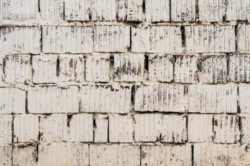 texture painted old brick wall, damaged uneven brickwork, abstract background