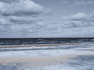 Endless expanses on a snow-covered beach in Jurmala, on the shore of the Gulf of Riga, in winter 2018.Latvia.