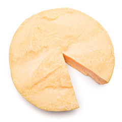 Whole round Head and pieces of parmesan or parmigiano