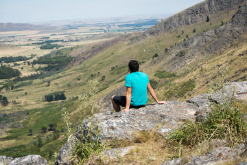Young man looking at the mountain landscape