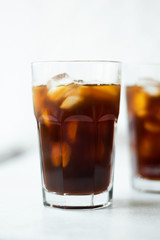 Cold brew. Coffee with ice on light background