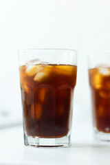 Cold brew. Coffee with ice on light background