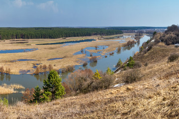 Spring landscape, panorama - spring flood in river valley of the Siverskyi (Seversky) Donets, the winding river over the meadows between hills and forests, border region of Ukraine near to Russia