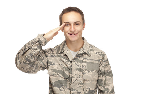 Smiling air force airman saluting