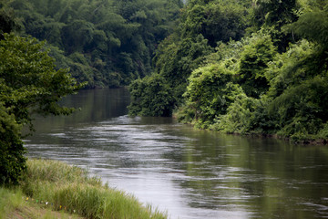 Fototapeta premium Khwae Noi River with nature of forest and mountain at Kanchanaburi Province Thailand.