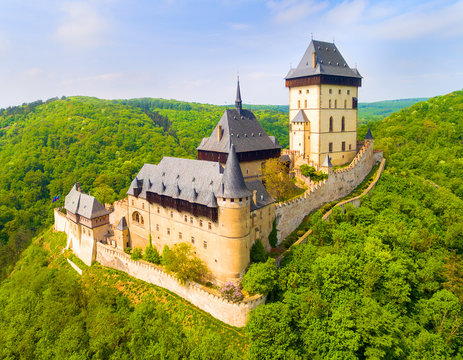 Aerial view to The Karlstejn castle. Royal palace founded King Charles IV. Amazing gothic monument in Czech Republic, Europe.