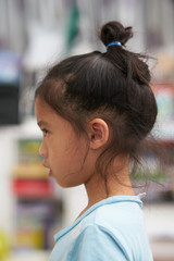 Portrait of side view of  Girl looking something