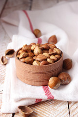 Peeled hazelnuts on the background of wood. useful snack, proper nutrition. how to peel the nuts.