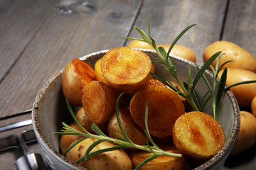 Roasted potato with fresh rosemary in a bowl