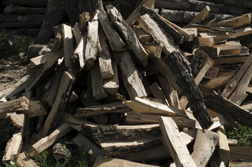 Cut logs fire wood. Renewable resource of energy. Environmental concept. Pile of chopped fire wood prepared for winter, ready for burning