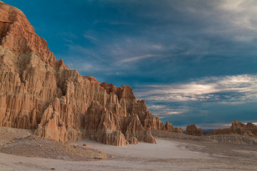 Majestic landscape of Cathedral Gorge State park at sunset with a magnificent cloudscape in Nevada USA.