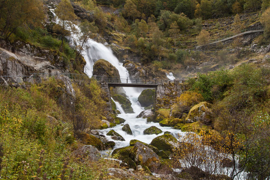 Bridge in front of the Kleivafossen Waterfall