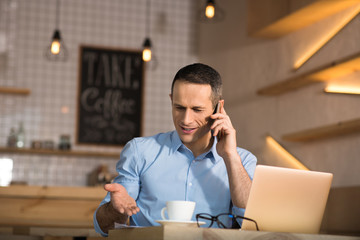 businessman talking on smartphone