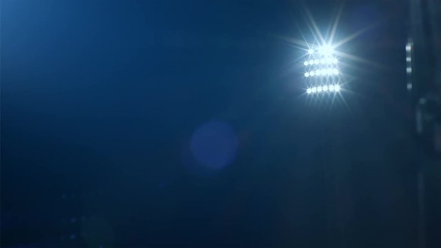 Dolly shot reveiling  football/soccer/sports stadium lights agains dark sky, 4k