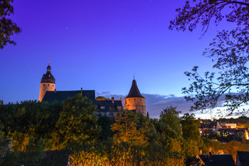 Fototapeta na wymiar Altenburg Germany -May 2018: the impressive residence castle in front of the blue night summer sky