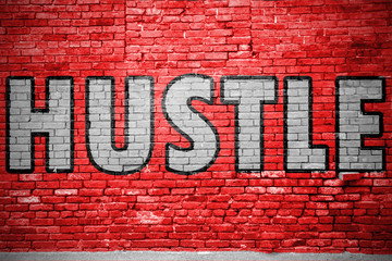 Hustle Ziegelsteinmauer Graffiti