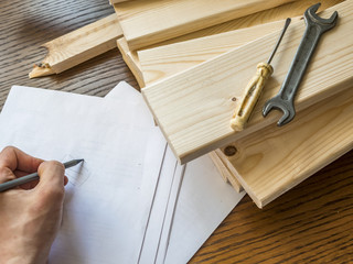 close up work place of carpenter on a wooden surface with wooden material