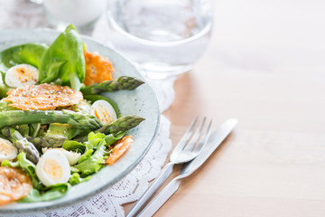 Asparagus Salad with quails eggs and cheese crisps