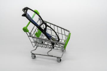 Eye glasses or Eye-Wear with shopping cart isolated on white