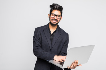 Young indian business man with laptop in hands isolated on white background