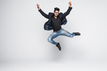 Fototapeta na wymiar Excited Indian businessman jumping for joy isolated on white background.
