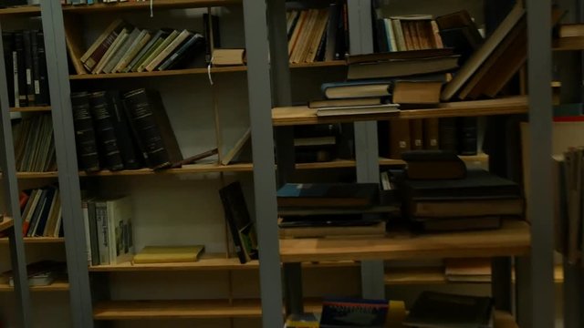 Shelf with books - You are lost in the library