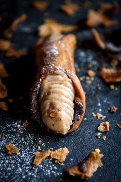 Close up to cannoli stuffed with ricotta and chocolate,selective focus