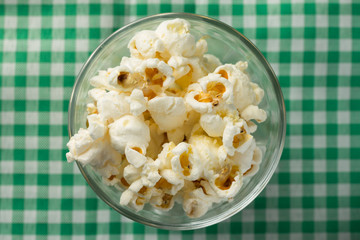Popcorn. Food of Festa Junina, a typical brazilian party. Snack on green plaid table.