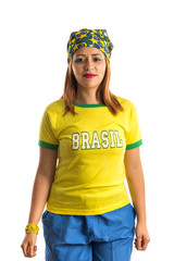 Brazilian woman fan celebrating on football match on white background. Brazil colors. Woman wearing generic brandless yellow t-shirt written 