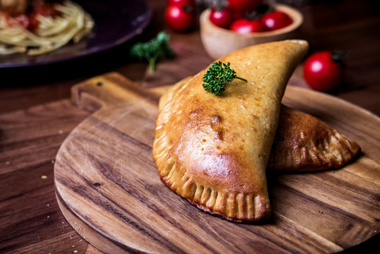 Pizza Puff Set On Dinner Table.