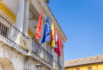 Fototapeta na wymiar Flags at the facade of the town hall of Toro, Spain