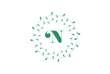  Letter N logo with round green leaves. Elegant floral monogram template design.