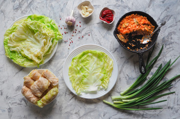 Cooking cabbage rolls stuffed with rice and vegetables, top view. 