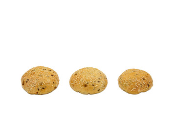 Rolls with sesame and raisin on white background